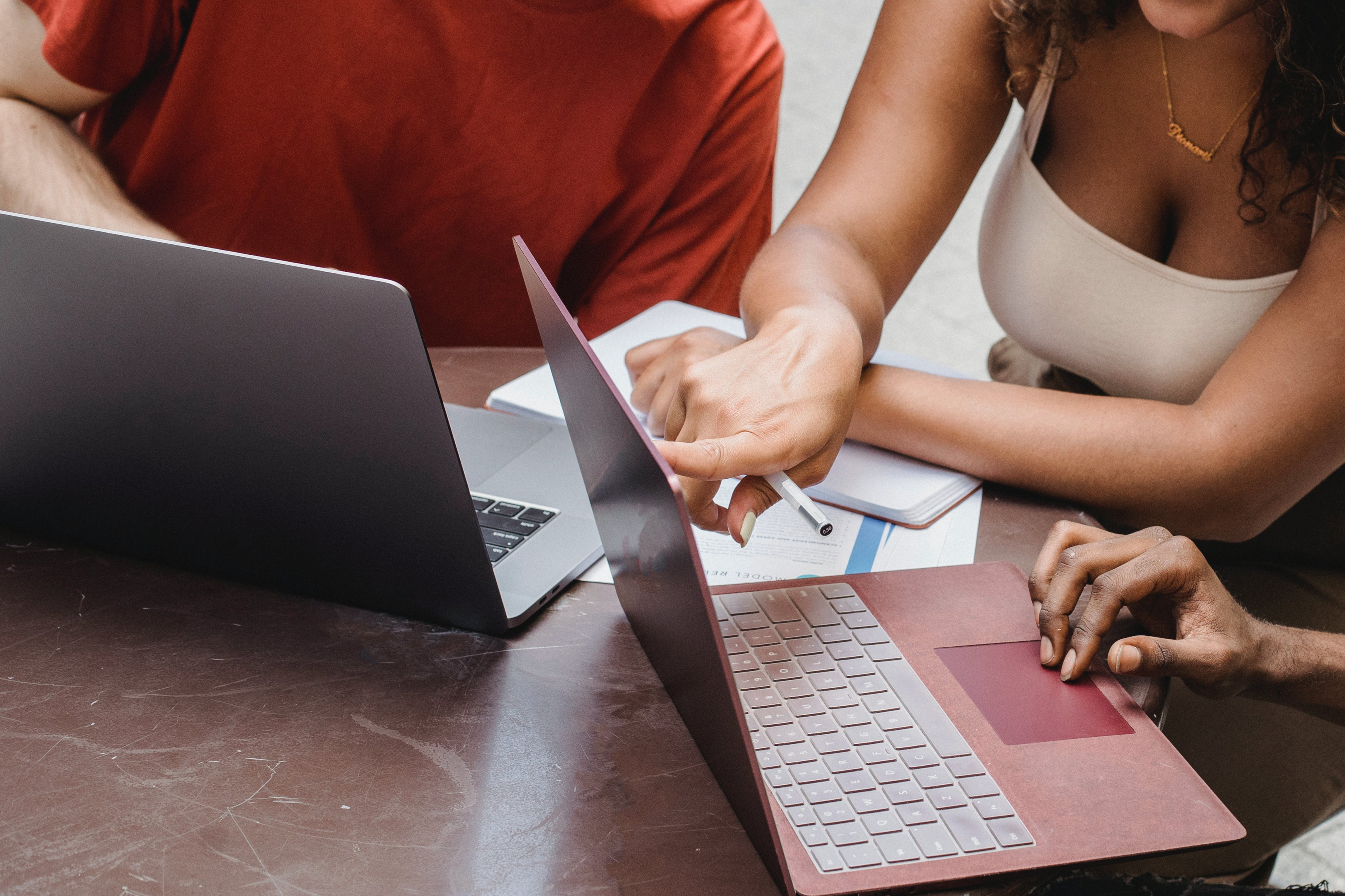 A person using a laptop to analyze data and identify risks